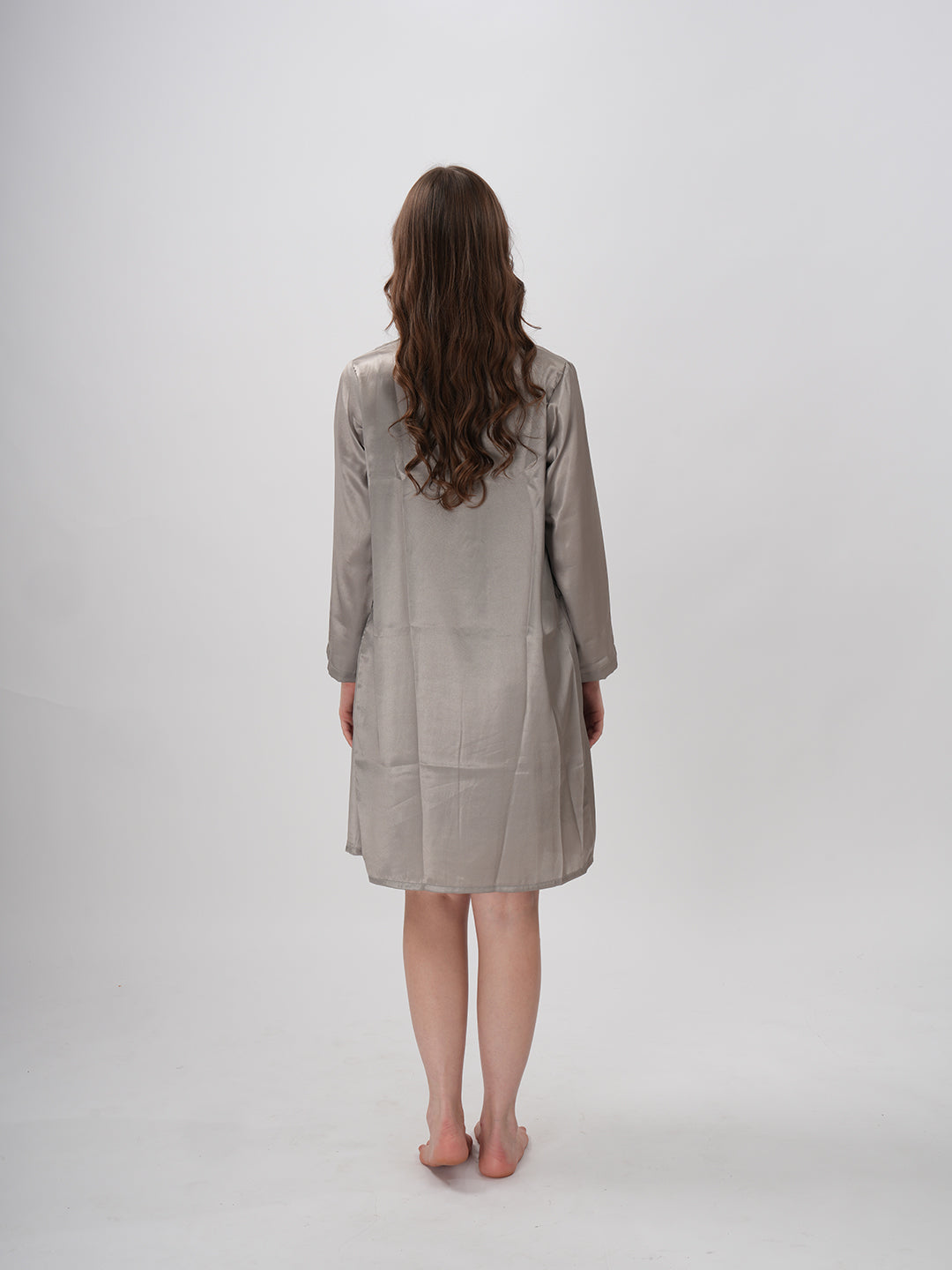 A woman modeling a grey robe with round collar neckline and above-knee length cut - Grey Nobels Robe