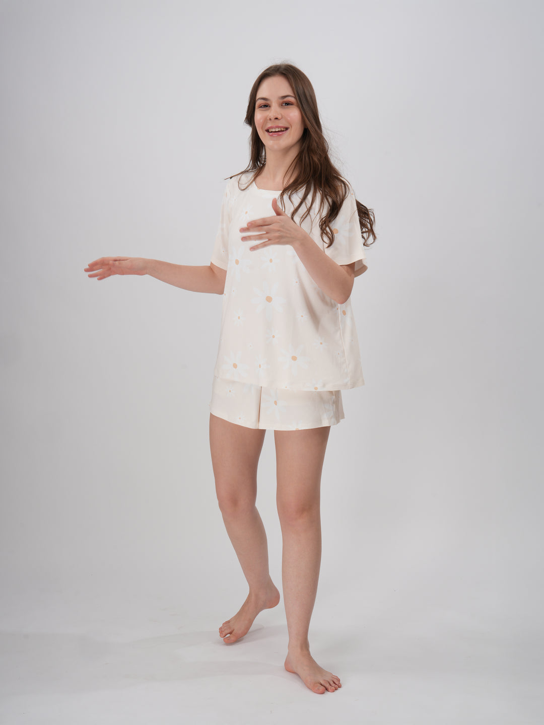 A female model wearing a cream colored short set with round neckline. - Prim Rose Short Set