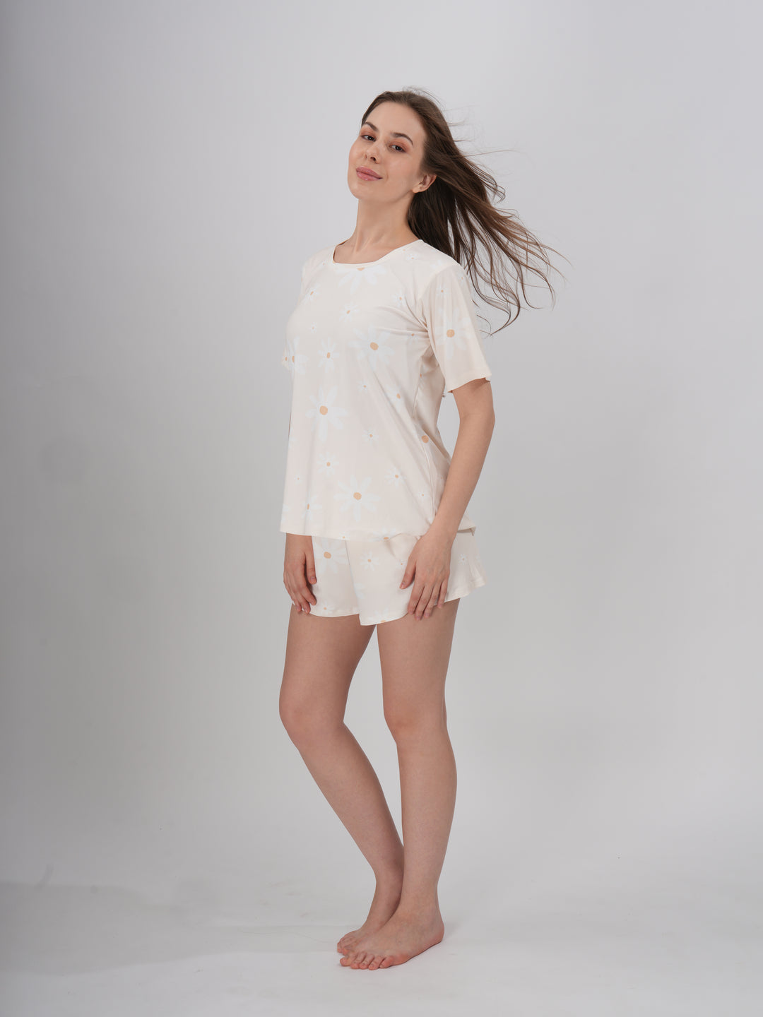 A female model wearing a cream colored short set with round neckline. - Prim Rose Short Set
